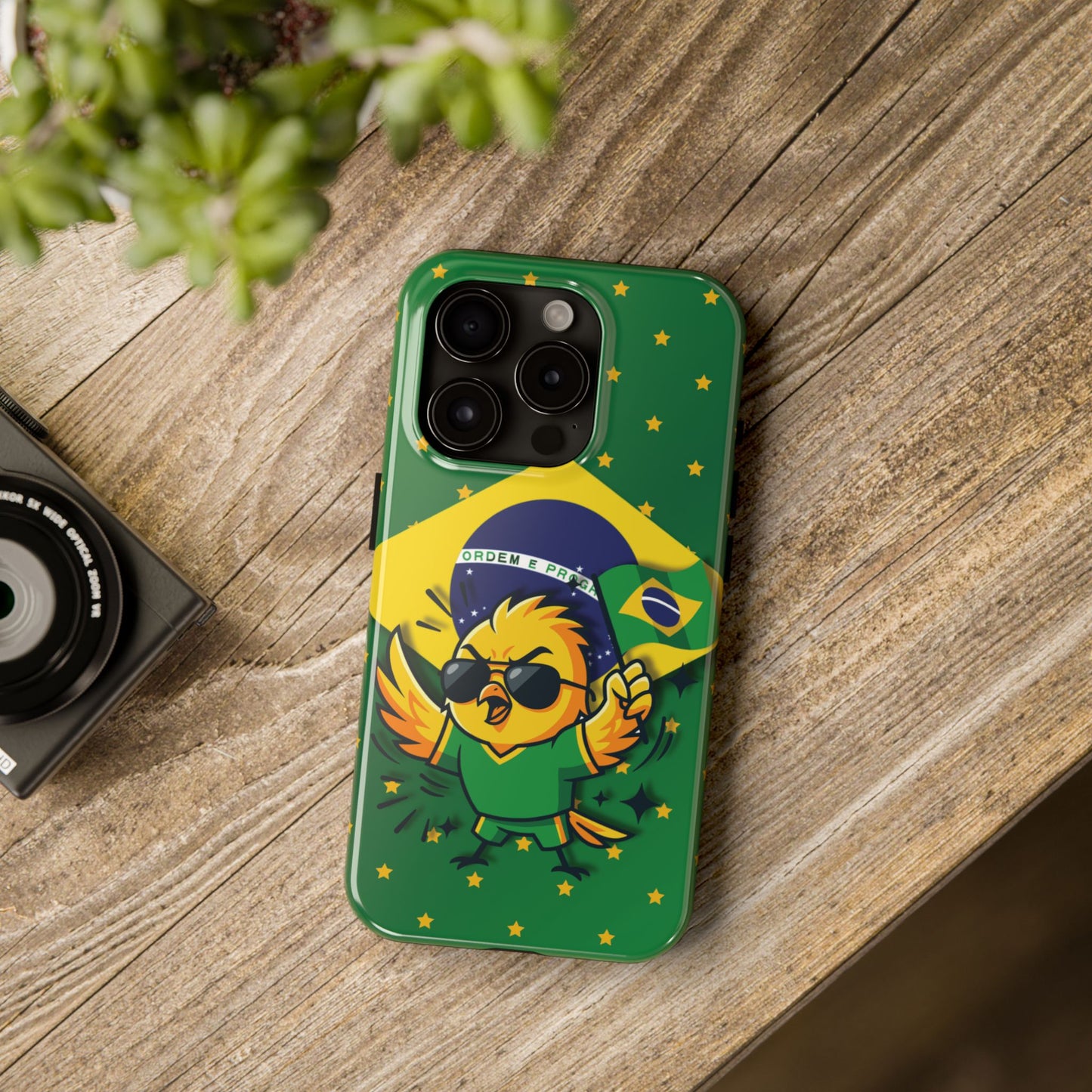 Tough phone case with cartoon sunglass-wearing bird draped in Brazil flag on green background with golden stars
