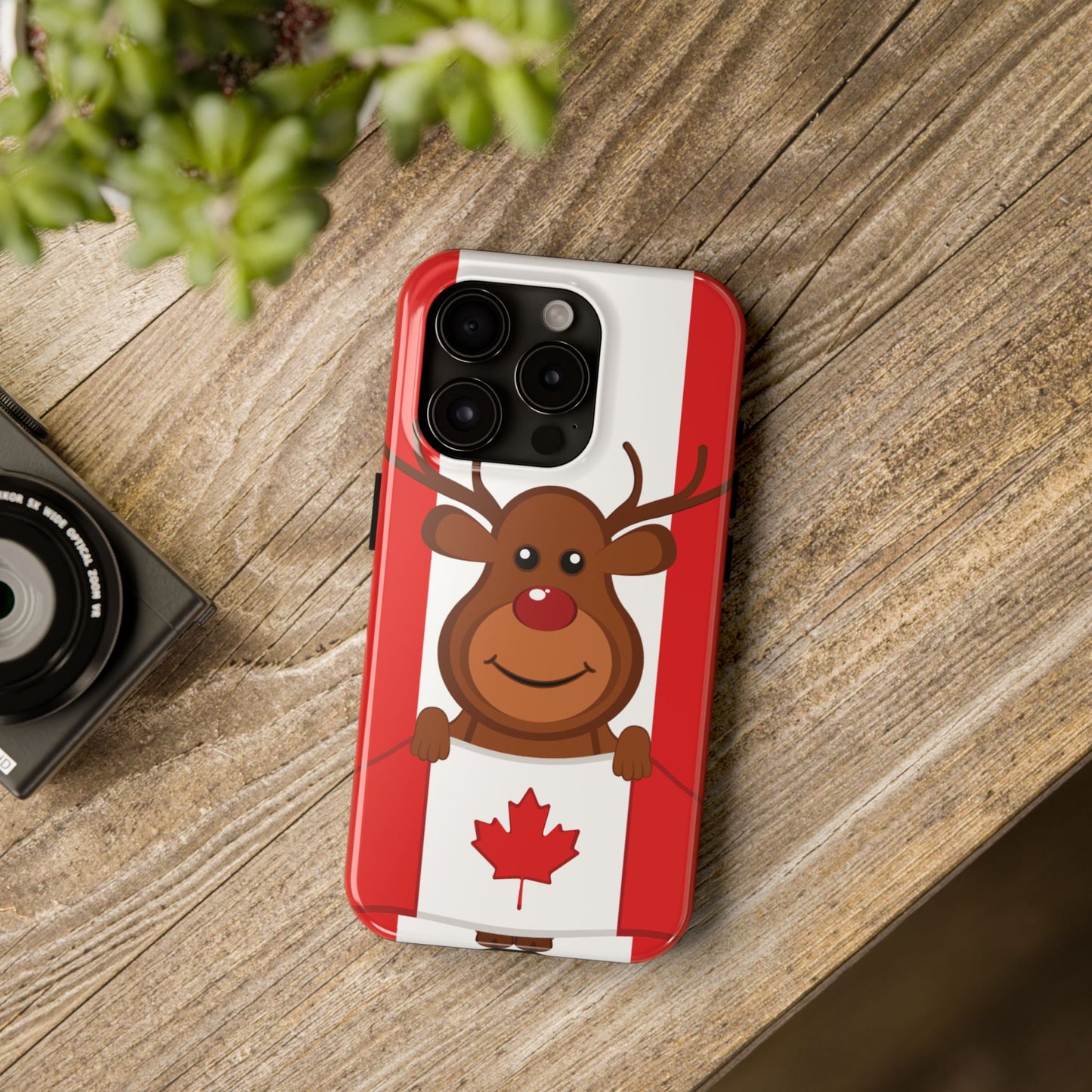Tough phone case with smiling reindeer and red-and-white Canadian flag festive design